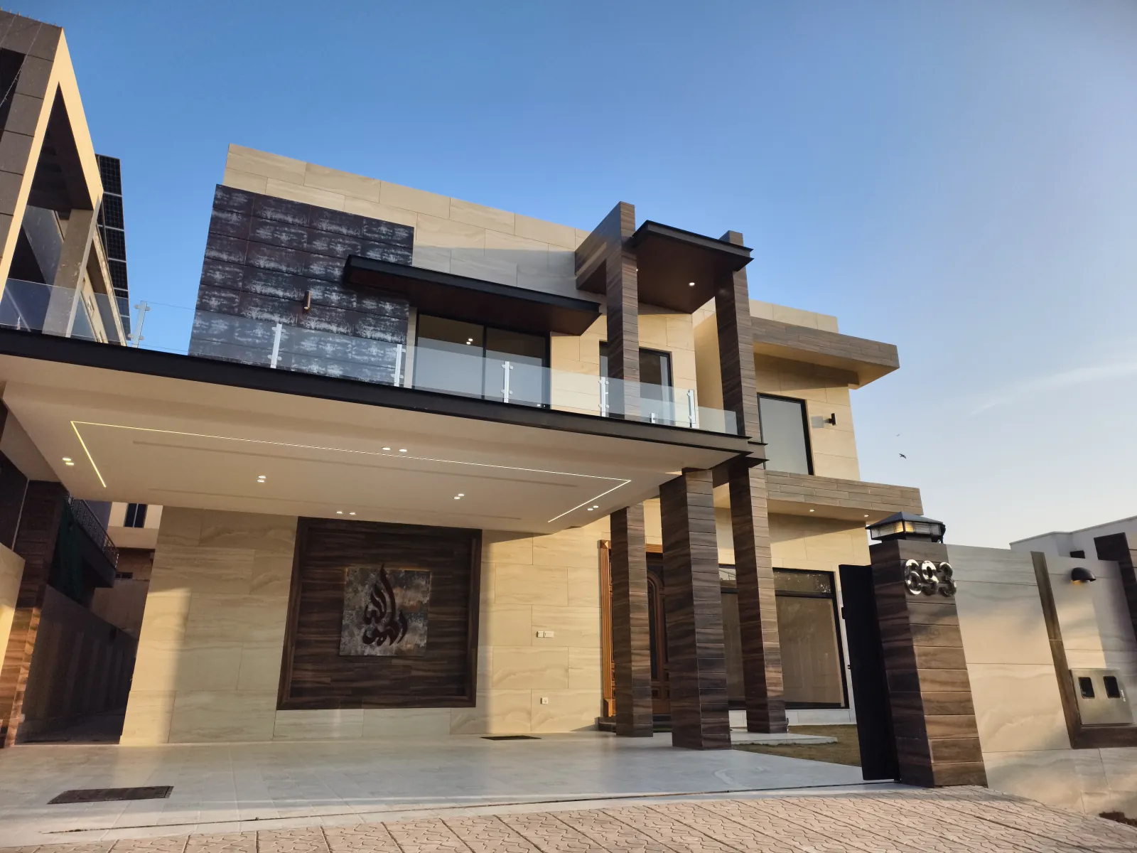 House 693 — travertine and timber-fin front elevation
